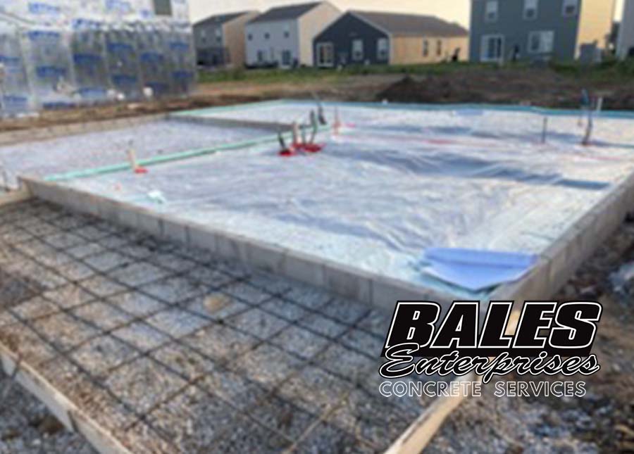 Skilled concrete installers creating intricate concrete designs